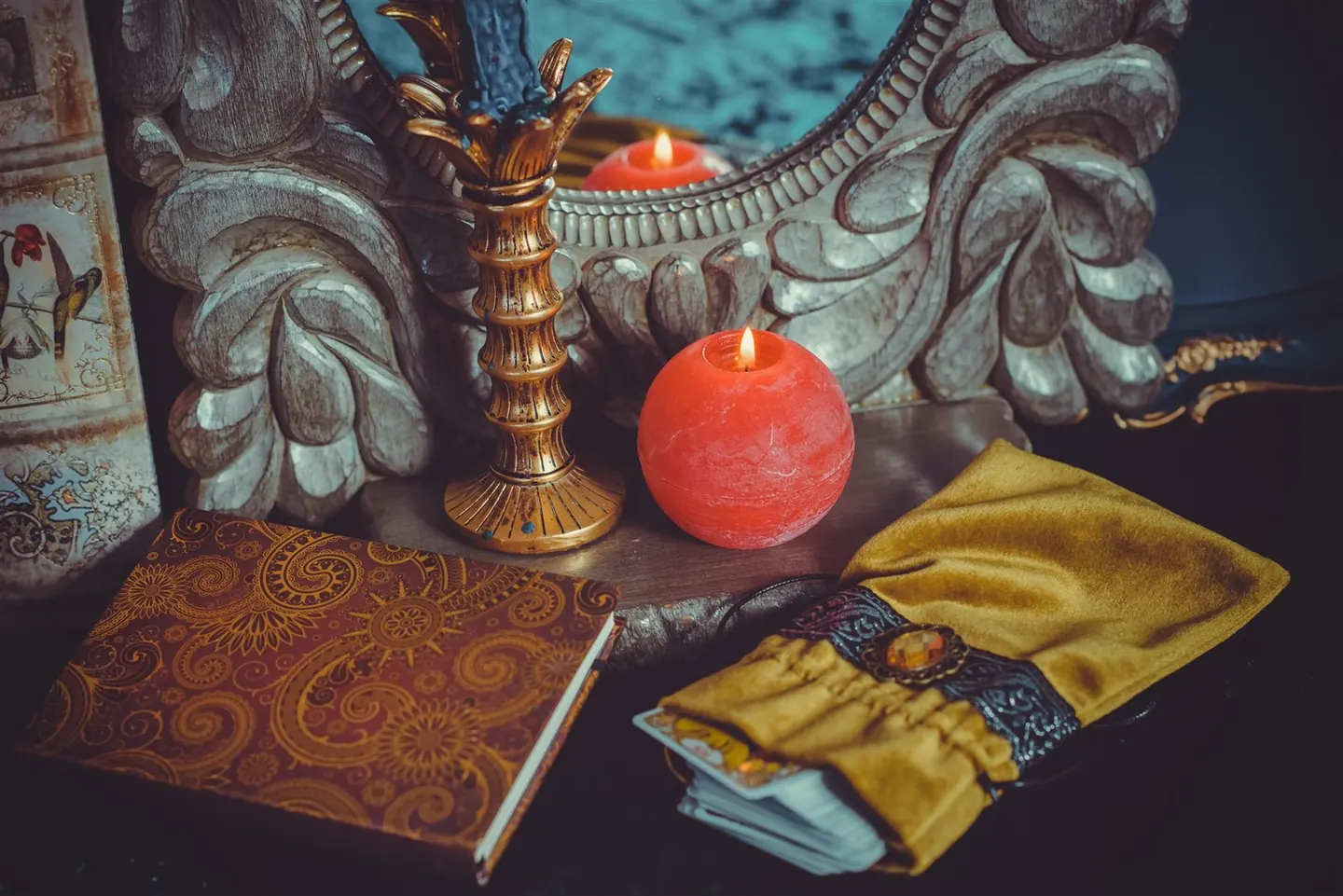 A candle beside an open book